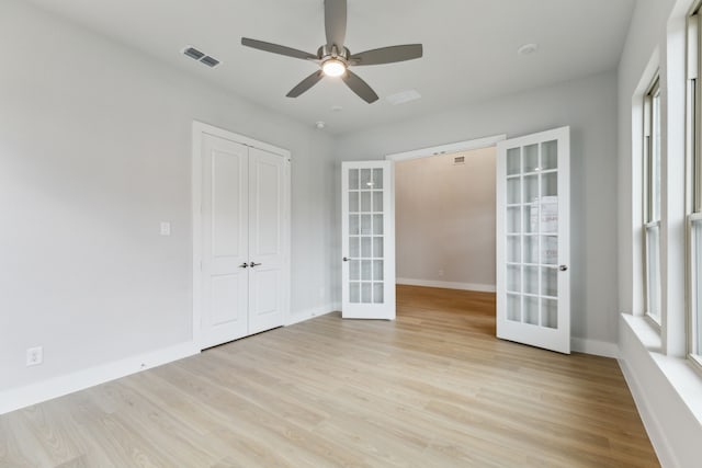 4505 N Summit View Dr, Mckinney, TX 75071 - empty room featuring french doors, light wood-style floors, and a ceiling fan