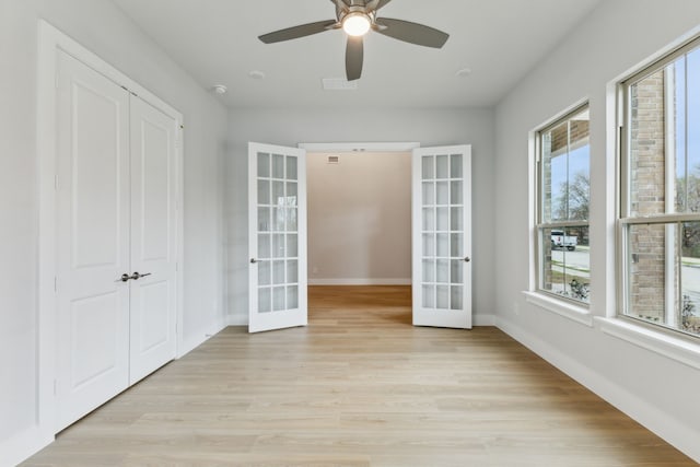 4505 N Summit View Dr, Mckinney, TX 75071 - empty room featuring french doors, light wood finished floors, and a ceiling fan