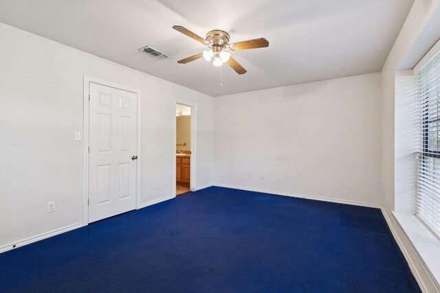 5602 Overridge Dr, Arlington, TX 76017 - unfurnished room featuring a ceiling fan and dark colored carpet