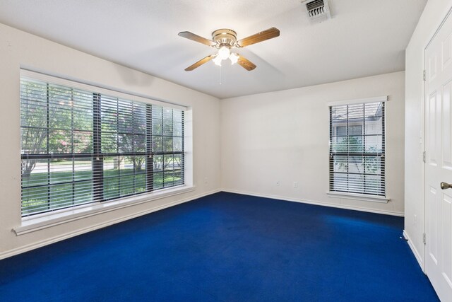 5602 Overridge Dr, Arlington, TX 76017 - unfurnished room with plenty of natural light, dark colored carpet, and a ceiling fan