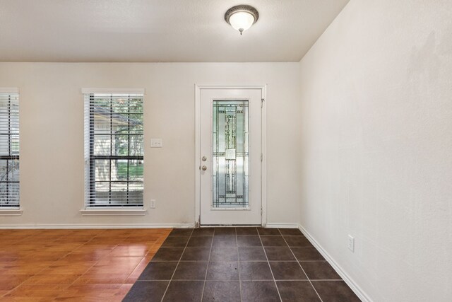 5602 Overridge Dr, Arlington, TX 76017 - entrance foyer with baseboards and dark tile patterned flooring