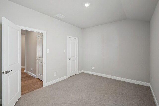 117 Whitlow Dr, Princeton, TX 75071 - unfurnished bedroom featuring light carpet and lofted ceiling