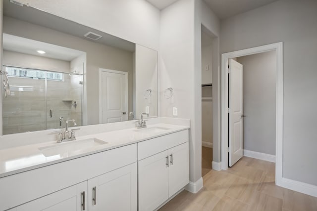 117 Whitlow Dr, Princeton, TX 75071 - bathroom with a stall shower, double vanity, and a spacious closet