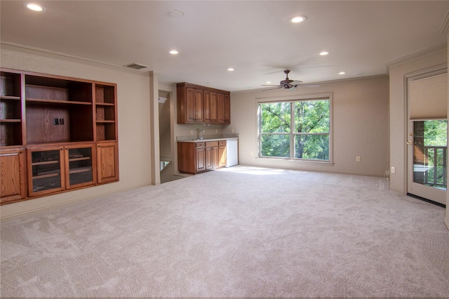 10111 Bluffview Cir, Pilot Point, TX 76258 - unfurnished living room featuring recessed lighting, crown molding, ceiling fan, plenty of natural light, and light carpet