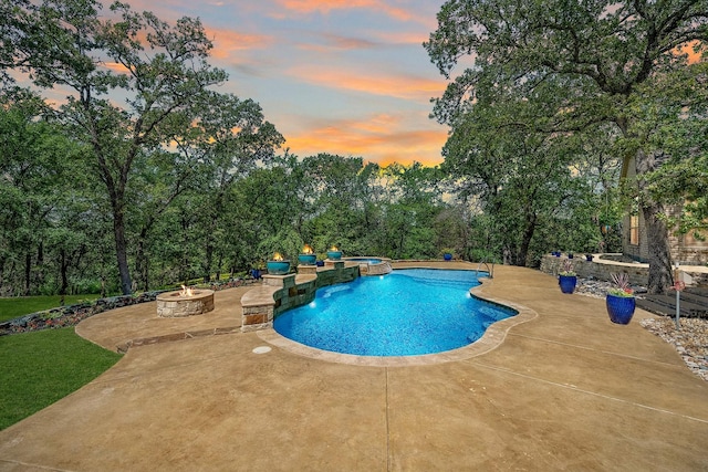 10111 Bluffview Cir, Pilot Point, TX 76258 - pool at dusk with an outdoor fire pit, a patio area, and a pool with connected hot tub