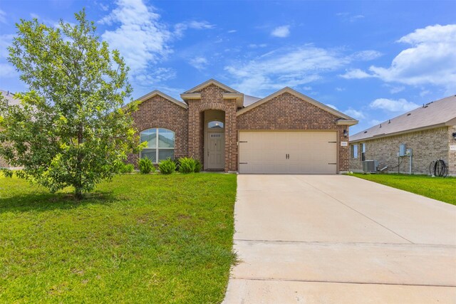 3008 Skinner Dr, Waco, TX 76655 - view of front of property with brick siding, a garage, a front lawn, and driveway