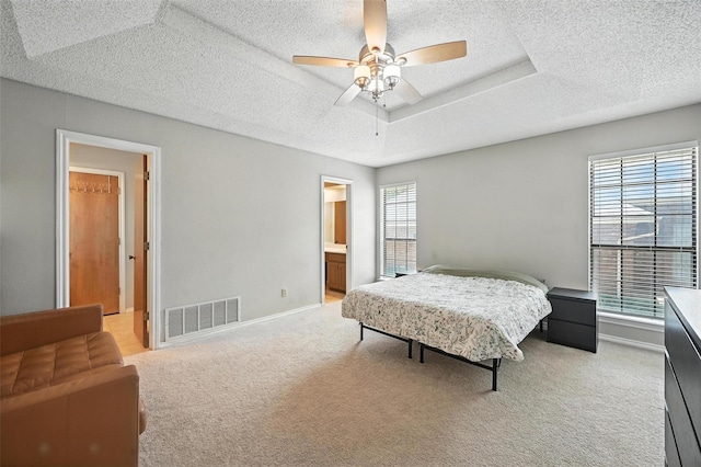 4603 Michelle Dr, Arlington, TX 76016 - bedroom with light colored carpet, a textured ceiling, ceiling fan, and ensuite bath