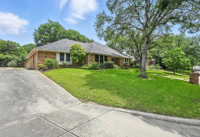 4603 Michelle Dr, Arlington, TX 76016 - single story home featuring a front lawn, brick siding, and roof with shingles