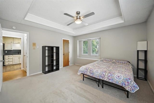 4603 Michelle Dr, Arlington, TX 76016 - bedroom with a tray ceiling, light carpet, ceiling fan, and a textured ceiling