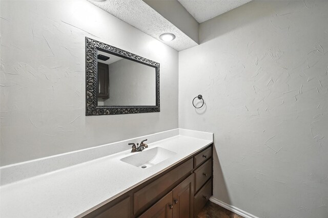 4603 Michelle Dr, Arlington, TX 76016 - bathroom with vanity and a textured ceiling