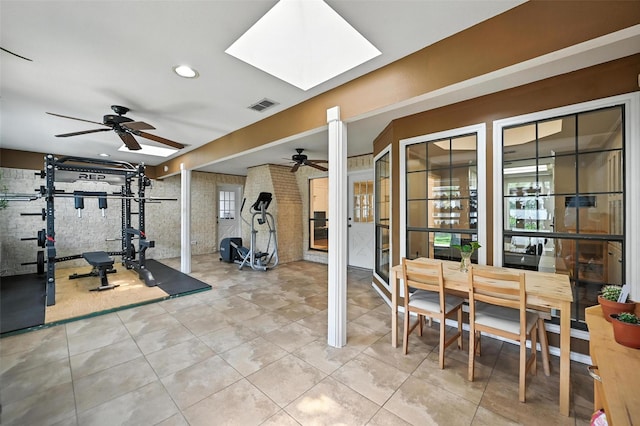 4603 Michelle Dr, Arlington, TX 76016 - exercise room with a ceiling fan, a skylight, tile patterned flooring, french doors, and recessed lighting