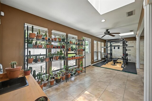 4603 Michelle Dr, Arlington, TX 76016 - exercise area featuring a skylight, a ceiling fan, tile patterned flooring, and recessed lighting