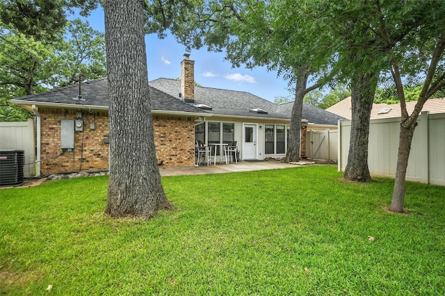 4603 Michelle Dr, Arlington, TX 76016 - back of house with a patio, brick siding, a chimney, and a shingled roof