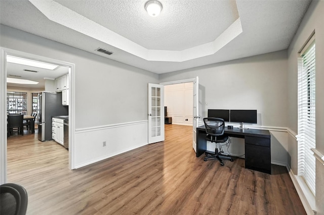 4603 Michelle Dr, Arlington, TX 76016 - office featuring wood finished floors, a textured ceiling, and french doors