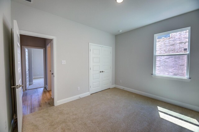 204 Savannah Ln, Oak Point, TX 75068 - unfurnished bedroom featuring carpet floors and a closet