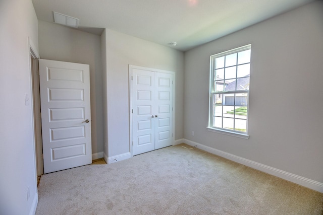 204 Savannah Ln, Oak Point, TX 75068 - unfurnished bedroom featuring carpet floors and a closet