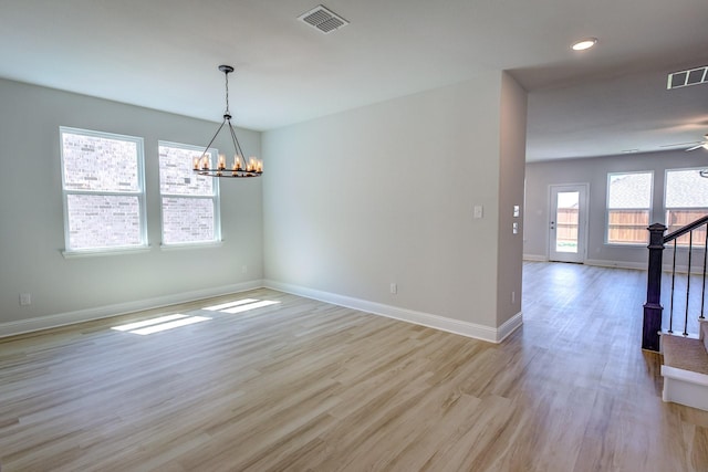 204 Savannah Ln, Oak Point, TX 75068 - empty room with light wood-type flooring, stairs, a chandelier, ceiling fan, and recessed lighting