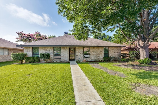 1608 Stroud Ln, Mesquite, TX 75150 - view of front facade featuring a front lawn, brick siding, a shingled roof, and a chimney