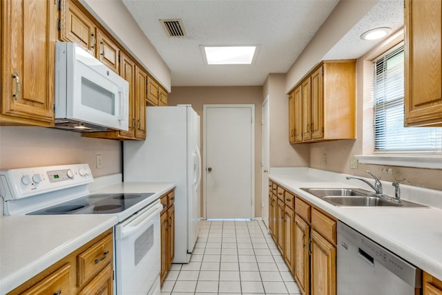 1608 Stroud Ln, Mesquite, TX 75150 - kitchen with white appliances, light countertops, and light tile patterned flooring