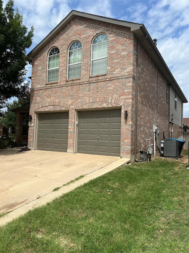 5901 Westgate Dr, Fort Worth, TX 76179 - view of side of property with an attached garage, brick siding, concrete driveway, and a yard