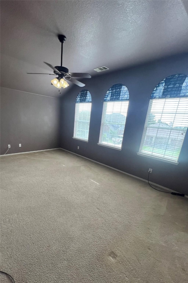 5901 Westgate Dr, Fort Worth, TX 76179 - carpeted spare room featuring a textured ceiling and a ceiling fan