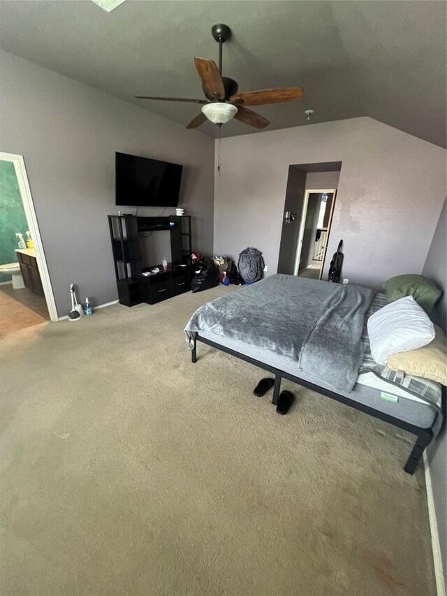 5901 Westgate Dr, Fort Worth, TX 76179 - bedroom with carpet floors, lofted ceiling, a ceiling fan, and ensuite bath