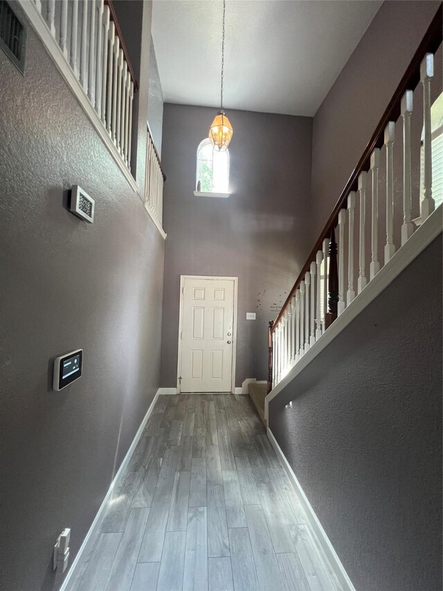 5901 Westgate Dr, Fort Worth, TX 76179 - foyer with stairs, a towering ceiling, and wood finished floors