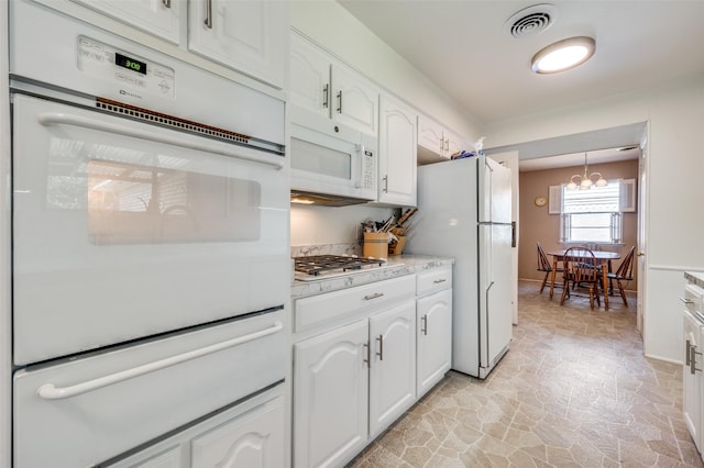 3256 Lancelot Dr, Dallas, TX 75229 - kitchen with white appliances, a warming drawer, and white cabinets