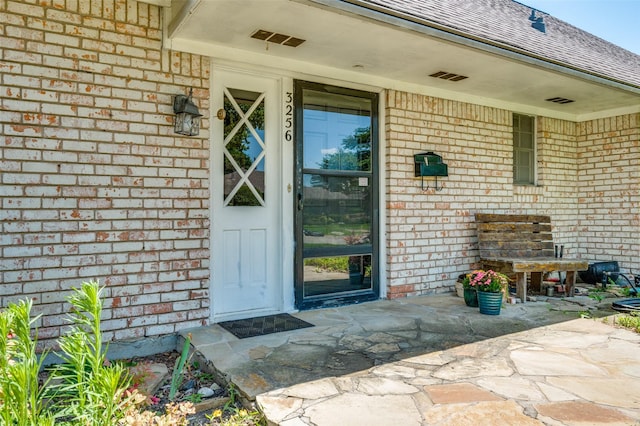 3256 Lancelot Dr, Dallas, TX 75229 - entrance to property with brick siding and a shingled roof