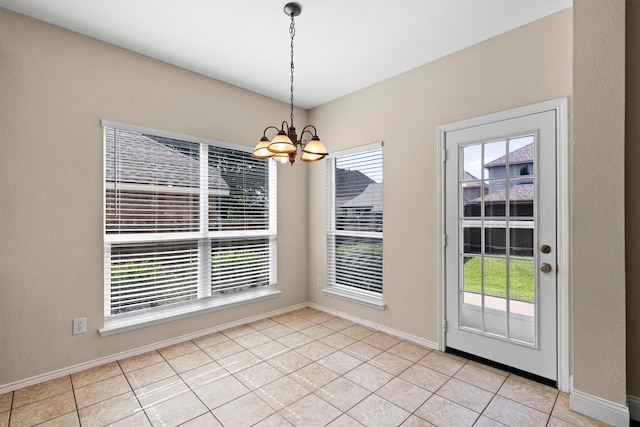 8516 Ontario Dr, Mckinney, TX 75072 - unfurnished dining area featuring a chandelier, healthy amount of natural light, and light tile patterned flooring
