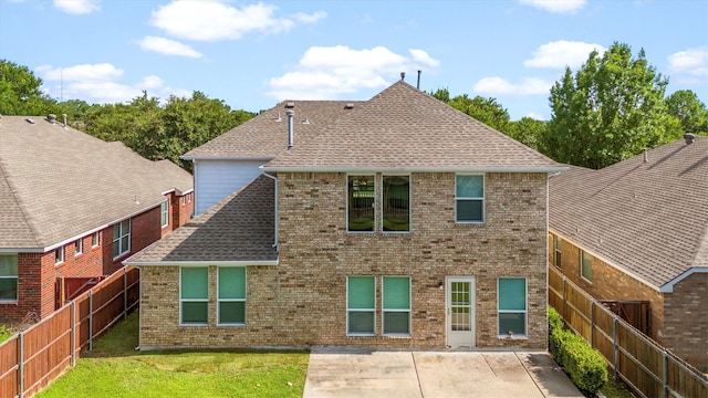 8516 Ontario Dr, Mckinney, TX 75072 - rear view of property with a patio, a fenced backyard, roof with shingles, and brick siding