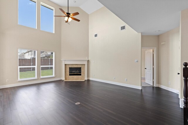 8516 Ontario Dr, Mckinney, TX 75072 - unfurnished living room featuring a ceiling fan, high vaulted ceiling, a fireplace, and dark wood-style flooring