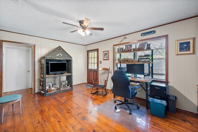 120 Woodland Ave, Corsicana, TX 75110 - office space with ceiling fan, wood-type flooring, a textured ceiling, and crown molding