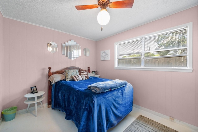 120 Woodland Ave, Corsicana, TX 75110 - bedroom featuring a textured ceiling, ornamental molding, and a ceiling fan