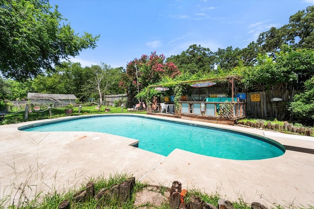 120 Woodland Ave, Corsicana, TX 75110 - view of pool with a patio, a fenced backyard, a diving board, and view of wooded area