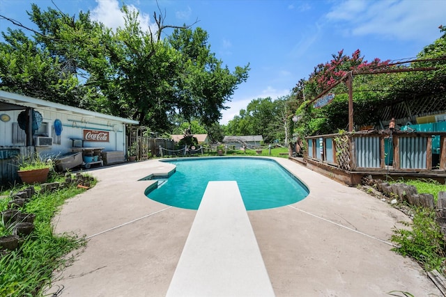 120 Woodland Ave, Corsicana, TX 75110 - view of swimming pool with a patio area, a diving board, and cooling unit