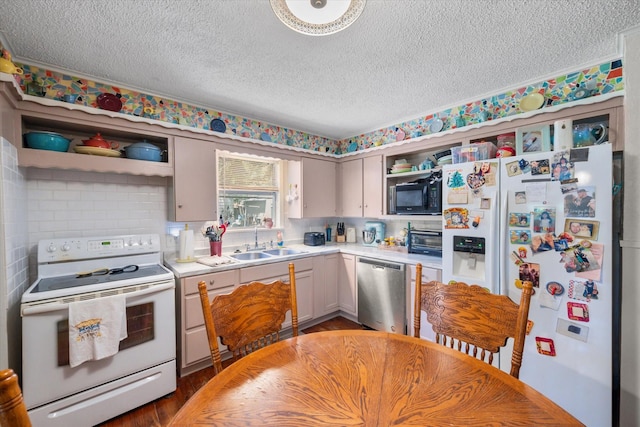 120 Woodland Ave, Corsicana, TX 75110 - kitchen featuring white appliances, open shelves, a textured ceiling, light countertops, and wood finished floors