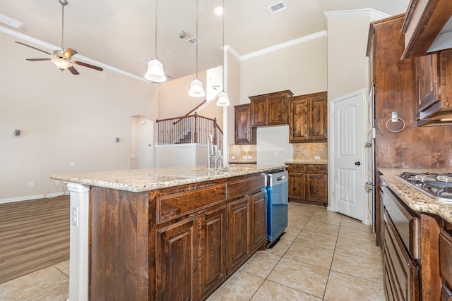 4600 Evenstar Way, Plano, TX 75074 - kitchen featuring ceiling fan, a towering ceiling, crown molding, dishwasher, and tasteful backsplash