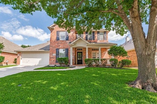 2400 Silverstone Ln, Mckinney, TX 75072 - traditional-style home featuring brick siding, an attached garage, driveway, and a front yard