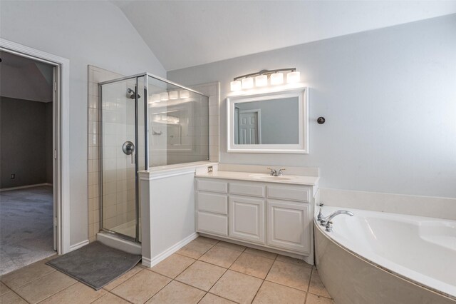 2400 Silverstone Ln, Mckinney, TX 75072 - full bath with tile patterned flooring, a stall shower, vanity, a garden tub, and vaulted ceiling