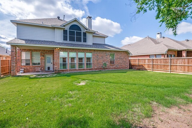 2400 Silverstone Ln, Mckinney, TX 75072 - rear view of property with brick siding, a fenced backyard, a chimney, and a patio