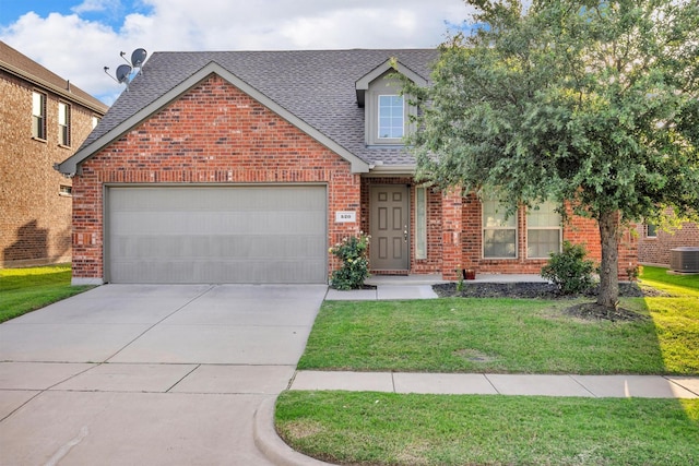 520 Rustic Oak Ln, Mckinney, TX 75072 - view of front of home with brick siding, roof with shingles, driveway, a front yard, and an attached garage