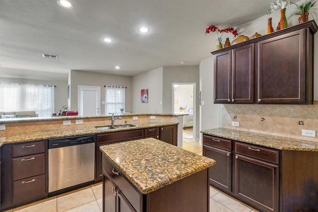 520 Rustic Oak Ln, Mckinney, TX 75072 - kitchen featuring dishwasher, light tile patterned floors, backsplash, plenty of natural light, and recessed lighting