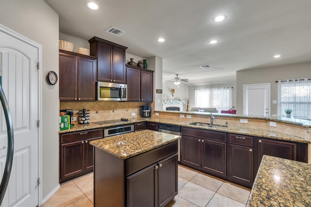 520 Rustic Oak Ln, Mckinney, TX 75072 - kitchen featuring appliances with stainless steel finishes, ceiling fan, backsplash, recessed lighting, and light tile patterned floors