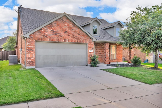 520 Rustic Oak Ln, Mckinney, TX 75072 - view of front facade with a shingled roof, an attached garage, concrete driveway, and brick siding