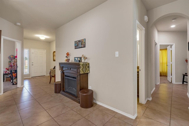 520 Rustic Oak Ln, Mckinney, TX 75072 - hall featuring light tile patterned floors and arched walkways