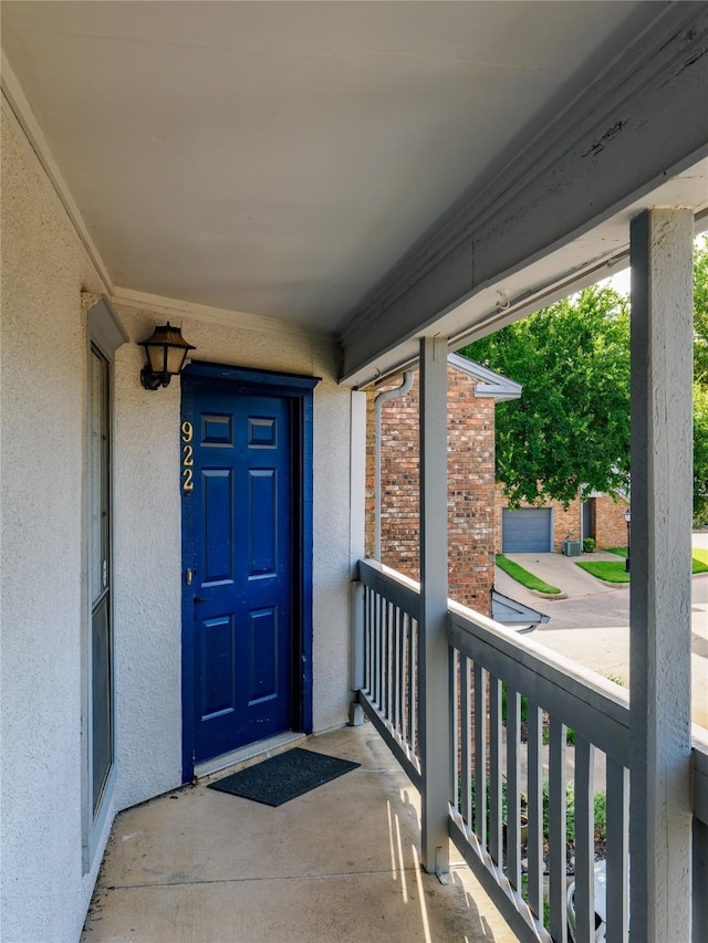 3101 Townbluff Dr Unit 922, Plano, TX 75075 - property entrance with stucco siding and covered porch