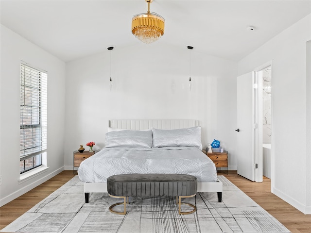 3101 Townbluff Dr Unit 922, Plano, TX 75075 - bedroom with wood finished floors and vaulted ceiling