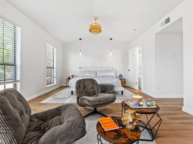 3101 Townbluff Dr Unit 922, Plano, TX 75075 - bedroom featuring light wood-style flooring and vaulted ceiling