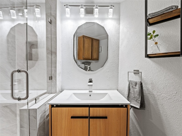 3101 Townbluff Dr Unit 922, Plano, TX 75075 - bathroom with a textured wall, vanity, and a stall shower